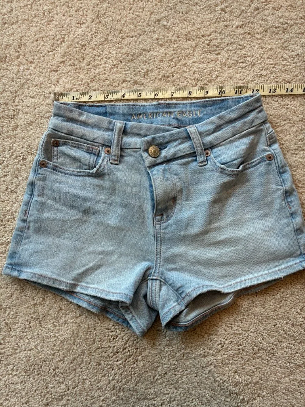 American Eagle Curvy High-Rise Shortie Stretch Jean Cross-Front Button Shorts - Picture 12 of 14